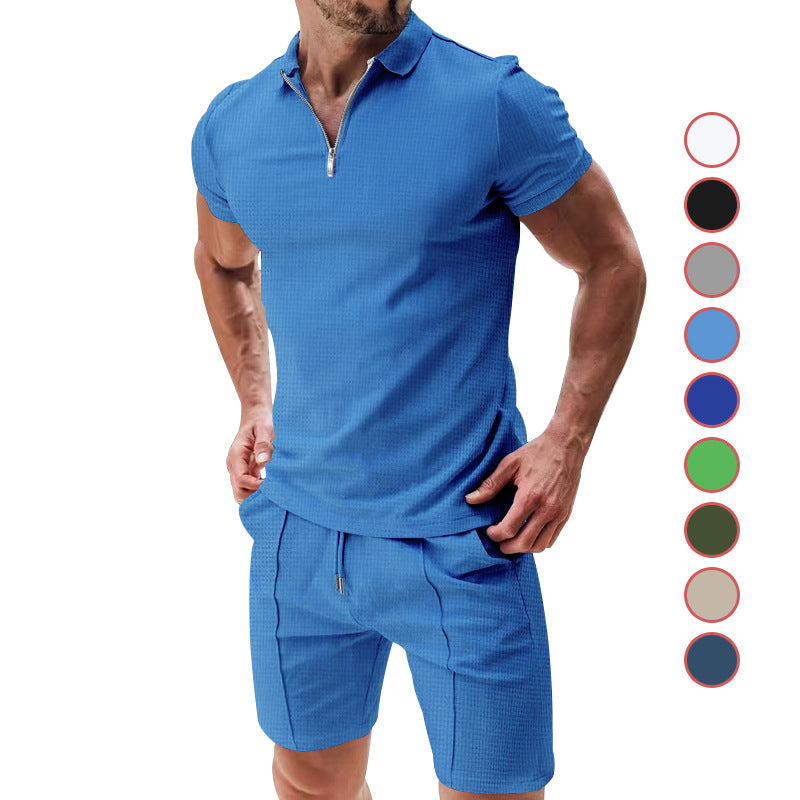 Man wearing a blue textured polo shirt and shorts with color swatches on the side.