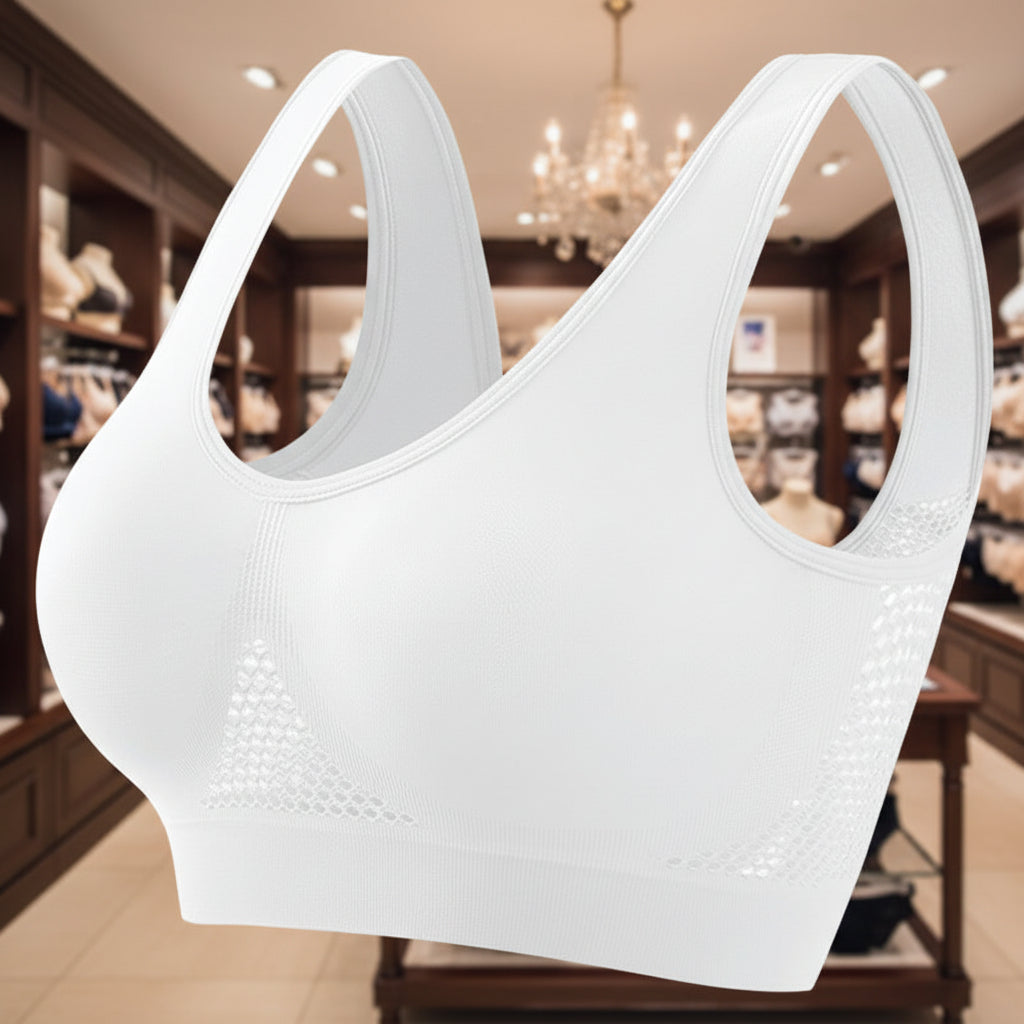 White sports bra with mesh panels on a white background