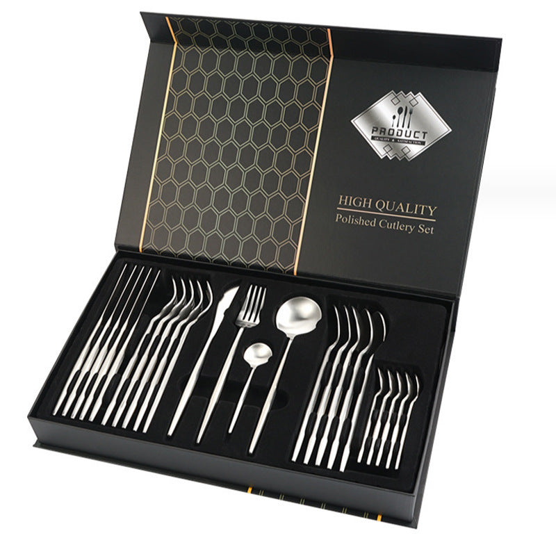 High-quality polished cutlery set in a black box with gold accents.