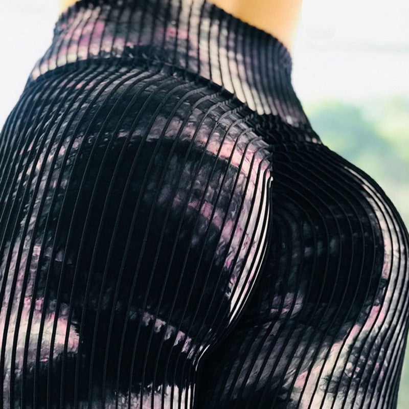 Close-up of a black sheer outfit with a blurred background