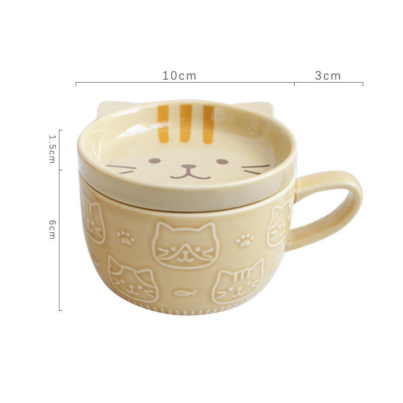 Cat-shaped ceramic mug with lid on a white background