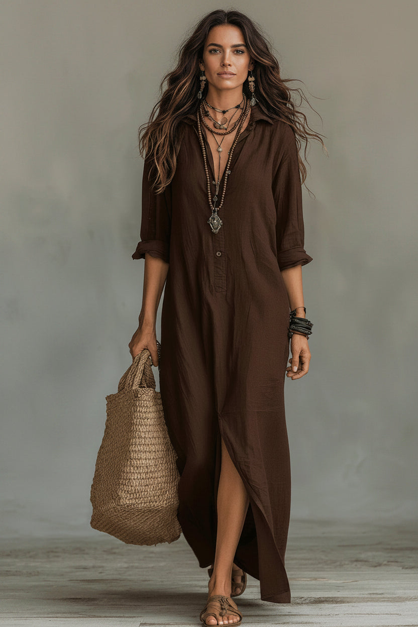 Woman wearing a brown dress holding a woven bag against a neutral background