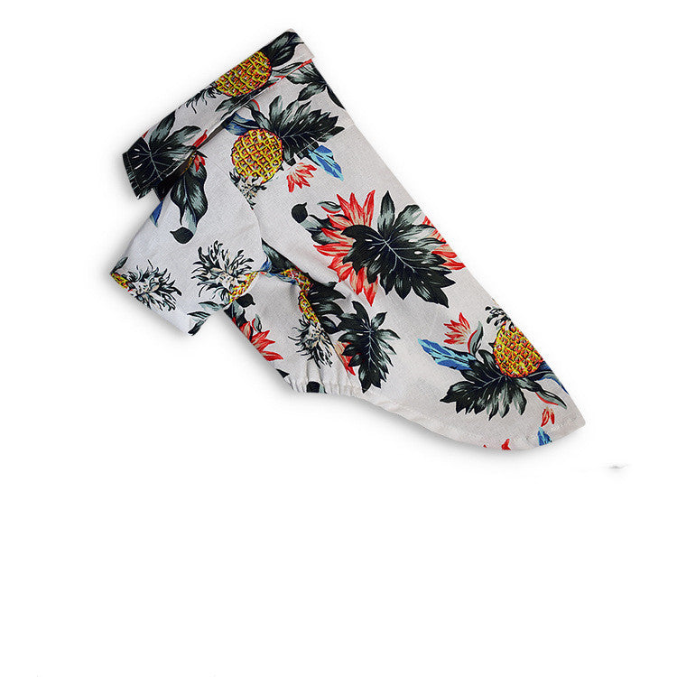 Folded fabric with tropical pattern on a white background
