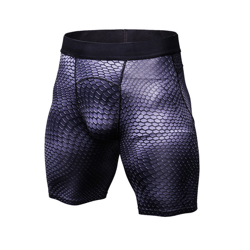 Black fish-scale patterned shorts on a white background