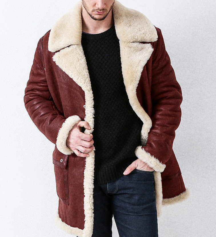 Man wearing a brown shearling coat with white fur lining on a plain background