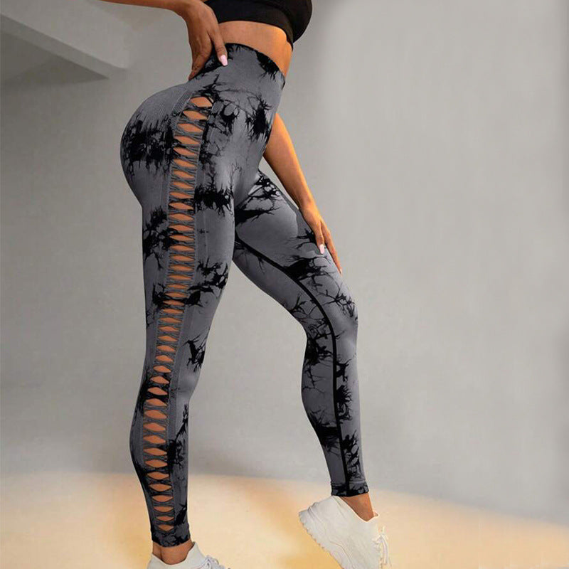 Gray tie-dye leggings with cut-out design on a plain background