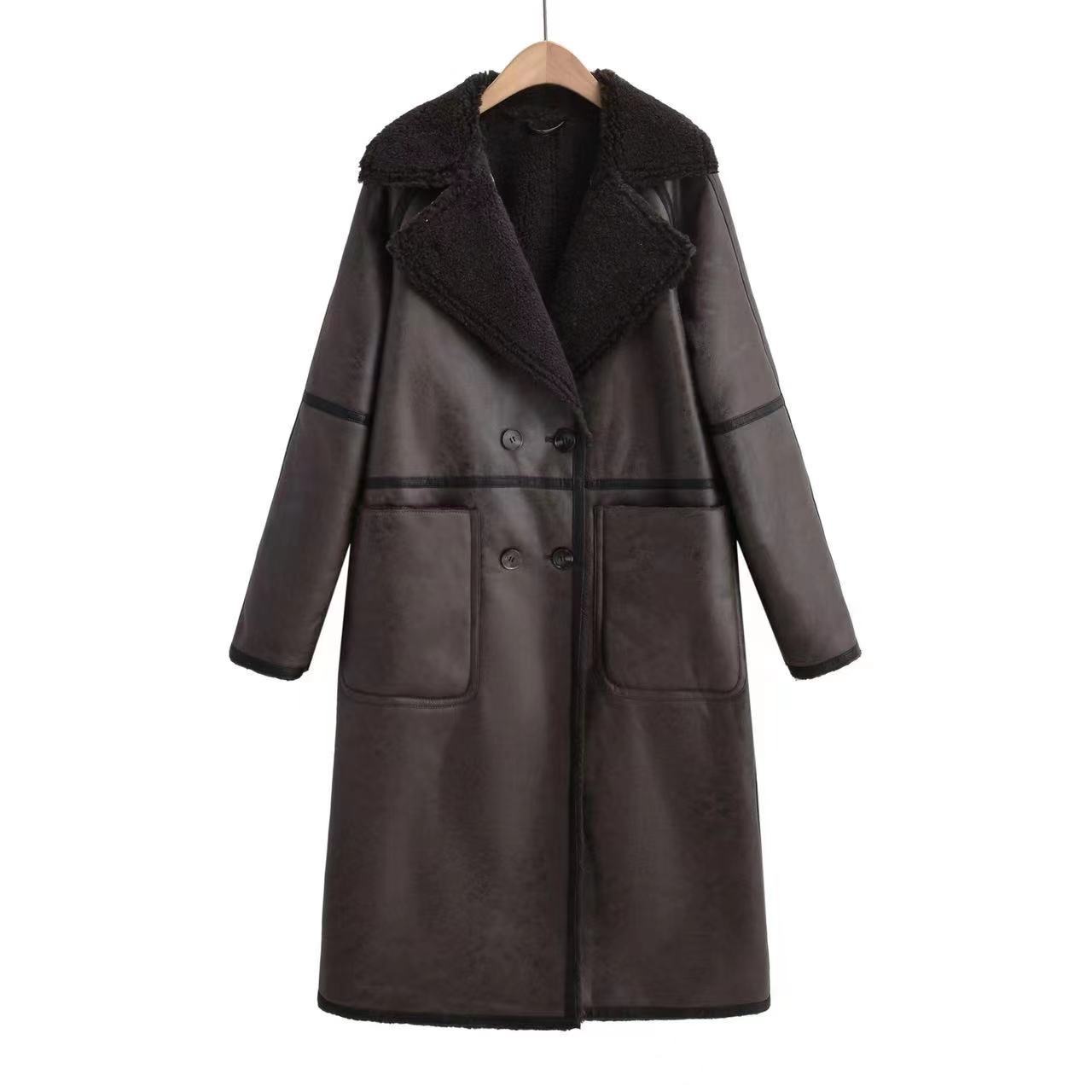 Brown leather coat with black lining on a hanger against a white background