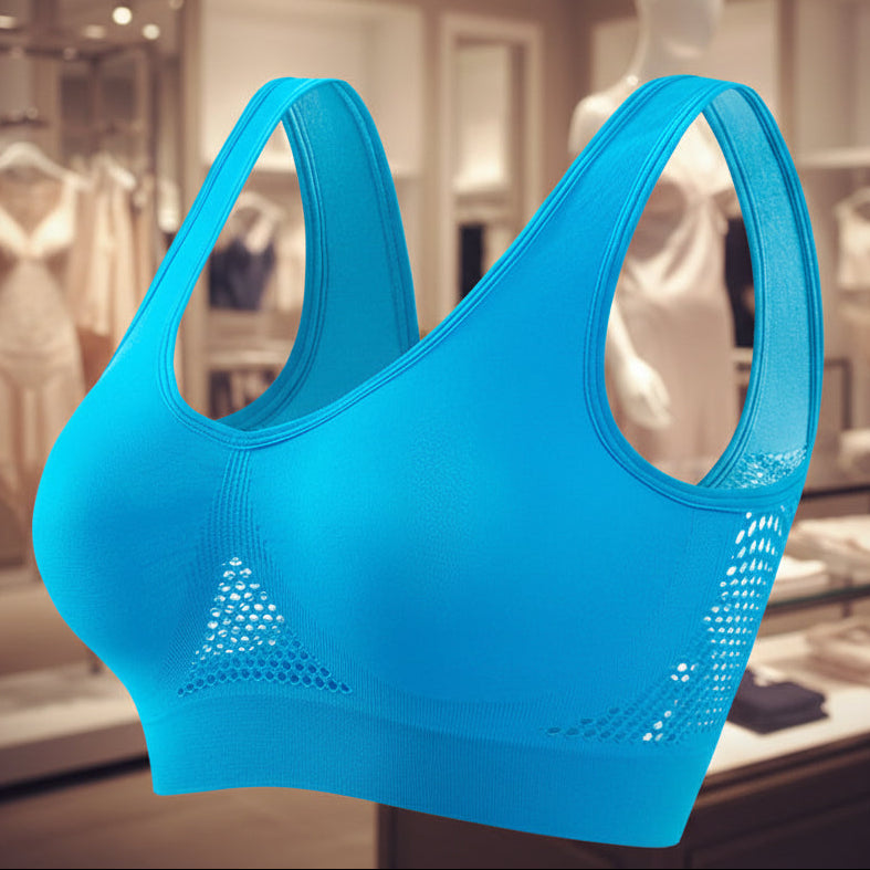 Blue sports bra with mesh accents on a white background