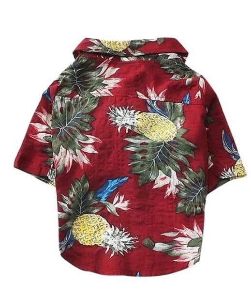 Red shirt with pineapple and leaf pattern on a white background