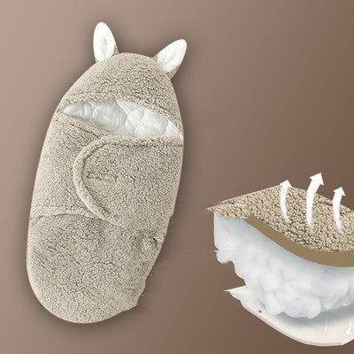 Baby wrap with animal ears and a close-up of its interior on a brown background