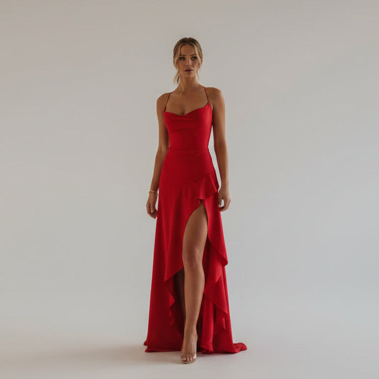 Red evening gown with a high slit on a white background