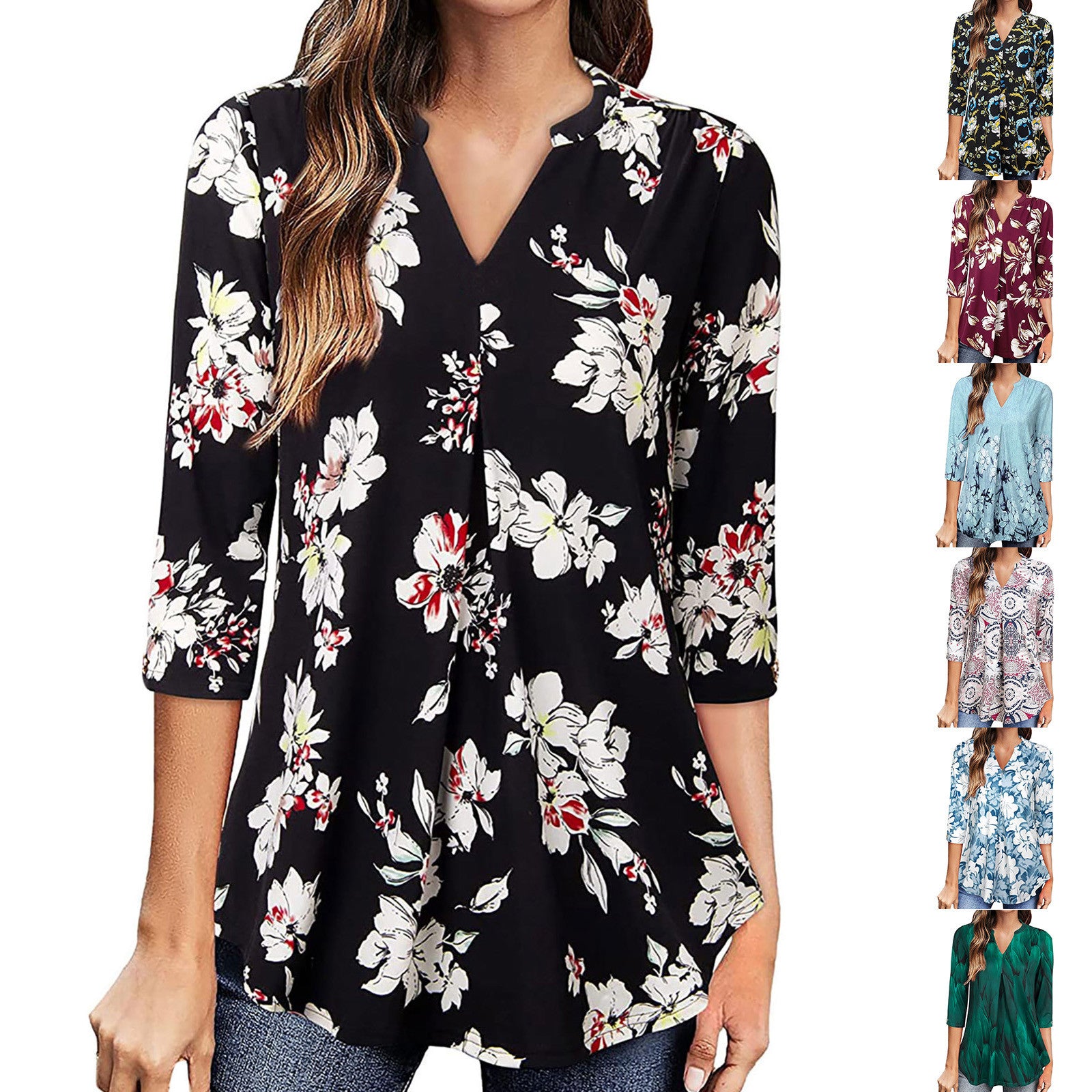 Floral blouse with a V-neck and 3/4 sleeves on a plain background