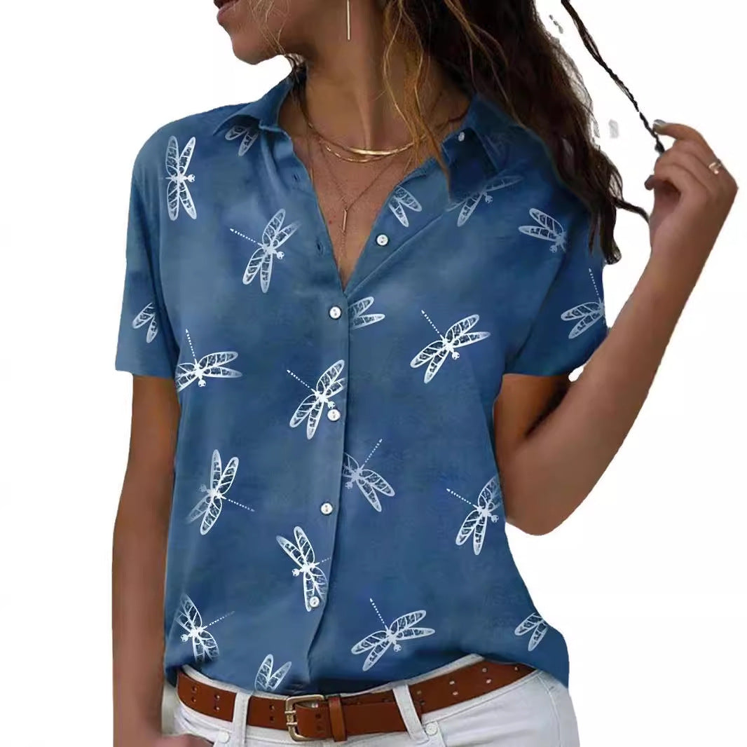 Woman wearing a blue shirt with white insect patterns on a white background