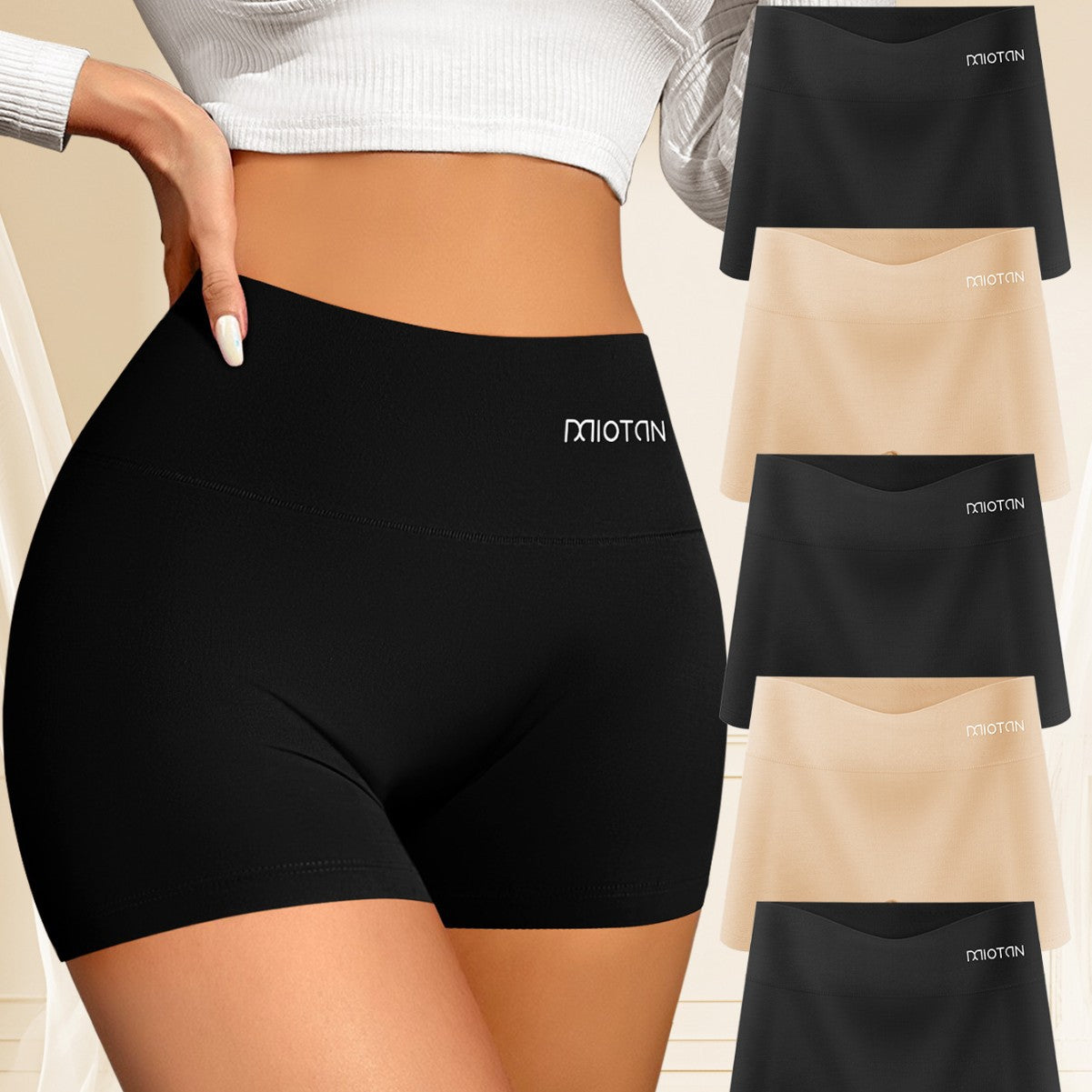 Black athletic shorts with a brand logo on a beige background