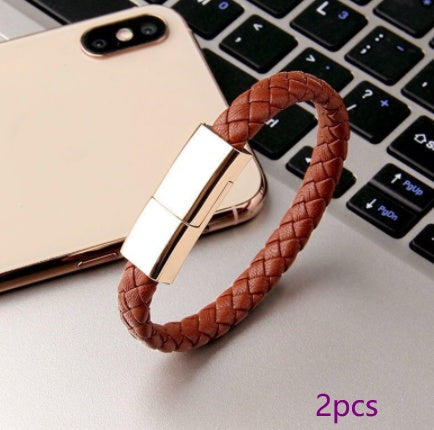 Brown braided USB drive with rose gold connector on a laptop keyboard