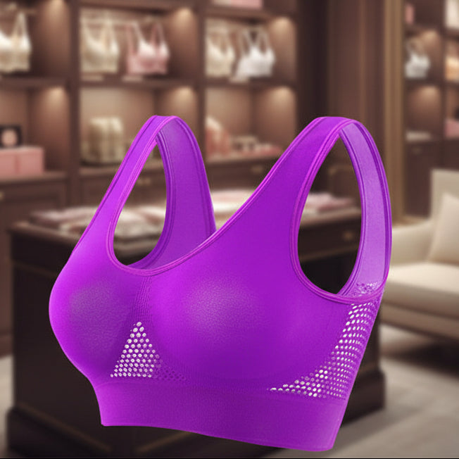 Purple sports bra with mesh accents on a white background
