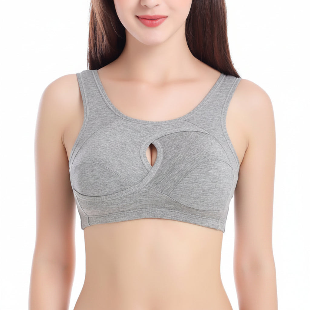 Gray sports bra worn by a model on a white background