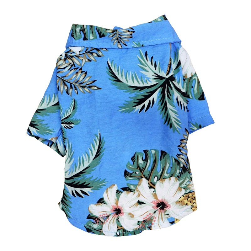Blue shirt with tropical leaf and flower pattern on a white background