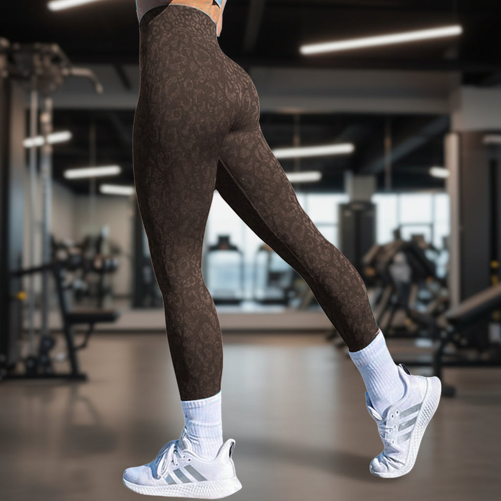 Maroon patterned leggings worn by a person on a white background