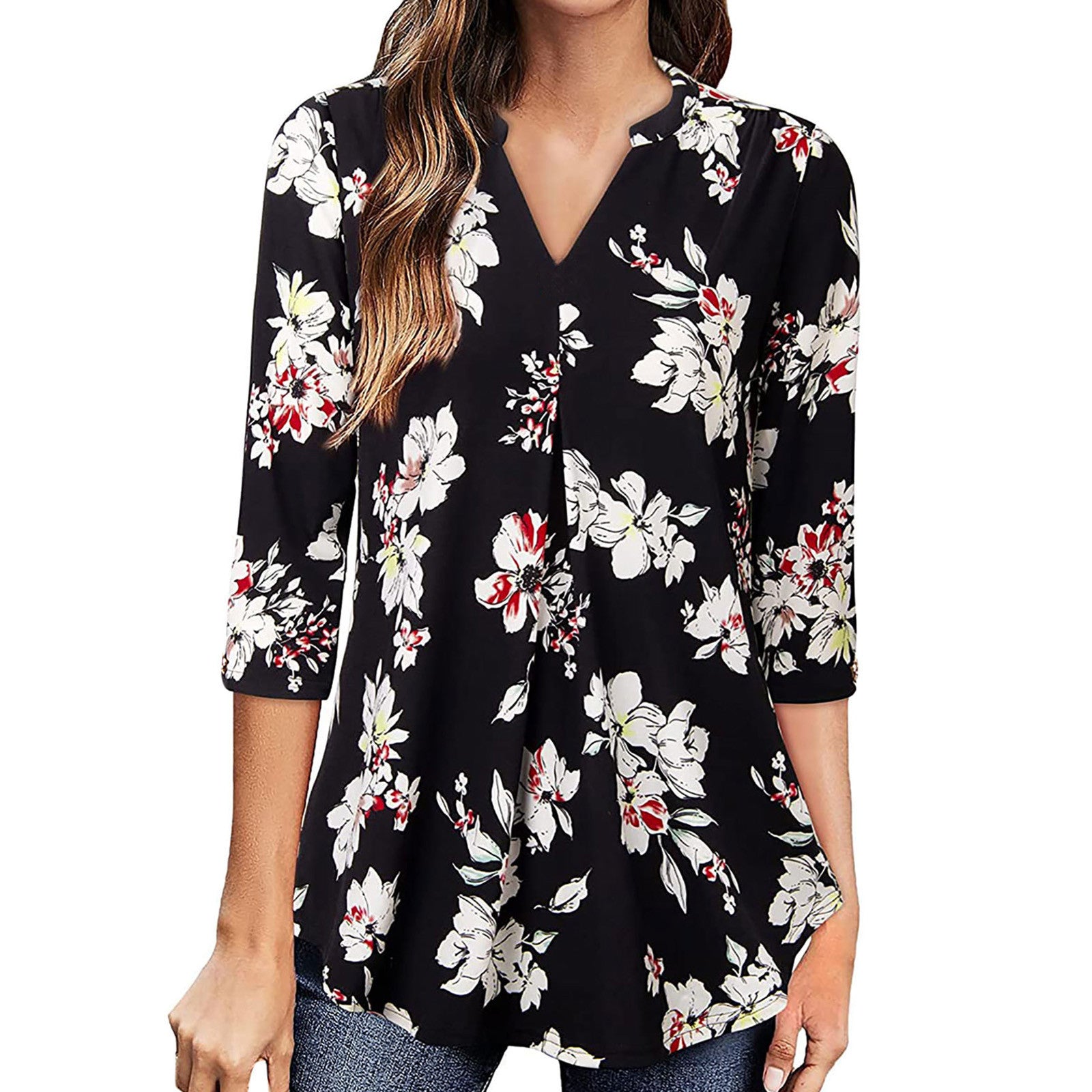 Black floral blouse worn by a person on a white background