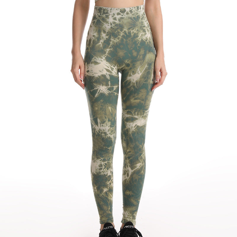 Tie-dye leggings worn by a person on a white background