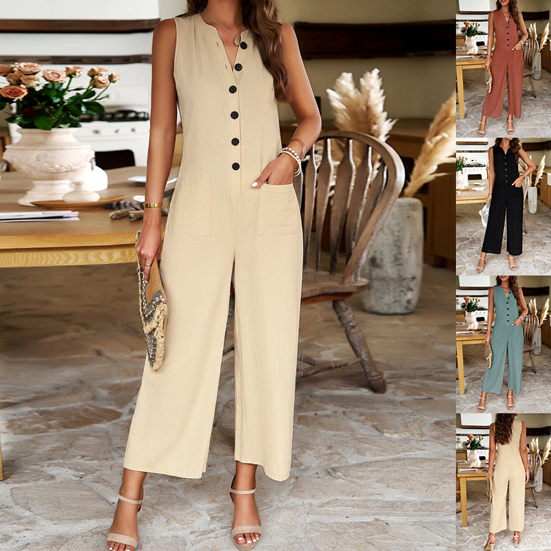 Woman wearing a beige jumpsuit in an indoor setting with decorative elements.