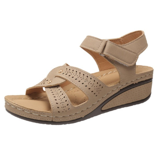 Beige wedge sandal on a white background
