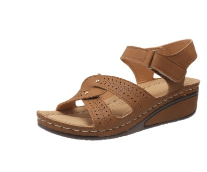 Brown sandal with a strap on a white background