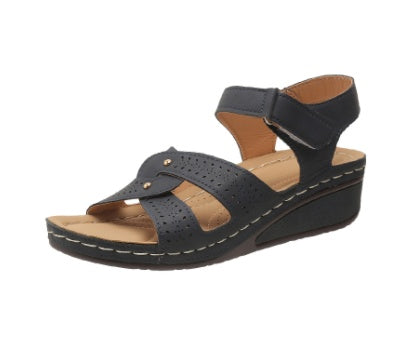 Black sandal with a wedge heel on a white background