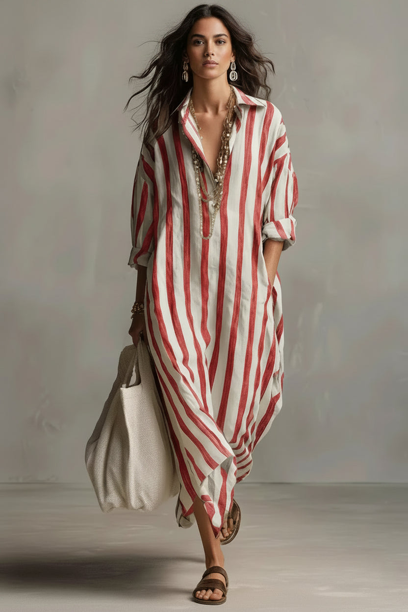 Woman wearing a red and white striped dress holding a beige bag against a neutral background