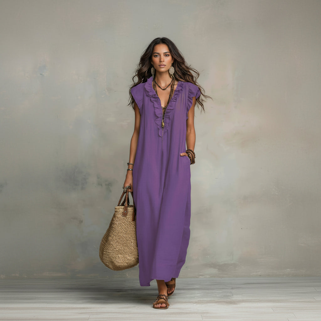Woman wearing a purple dress holding a straw bag against a neutral background