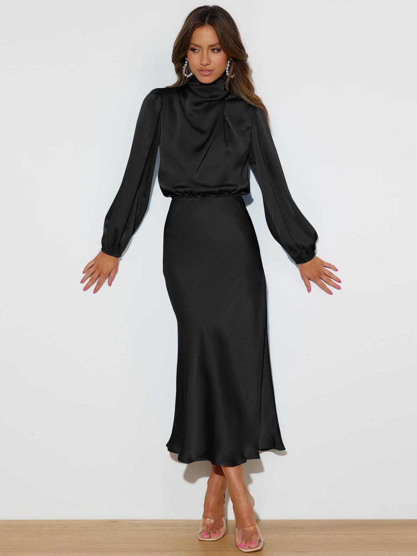 Woman wearing a black dress with a white background