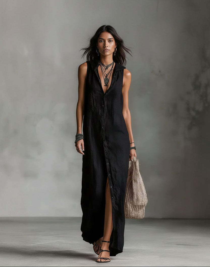 Woman wearing a black sleeveless dress with a textured background