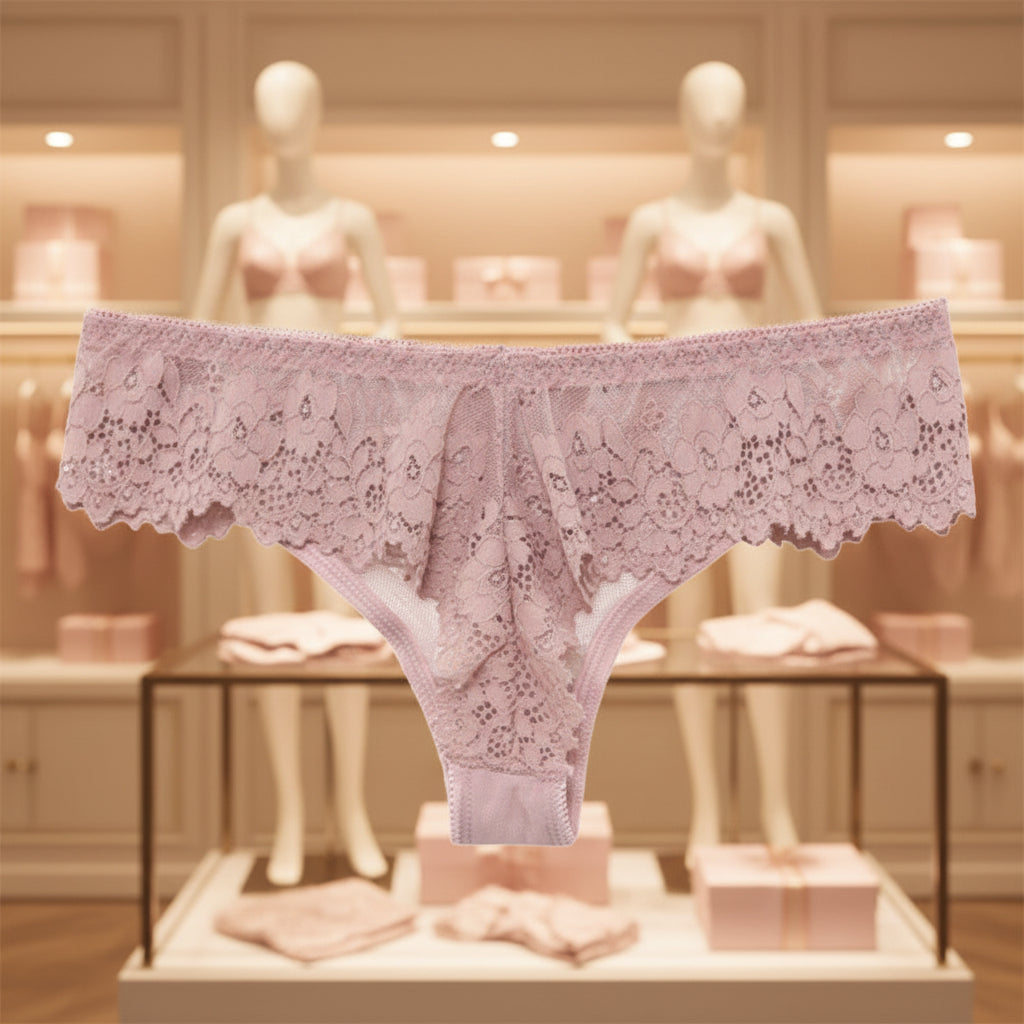 Pink lace thong on a white background