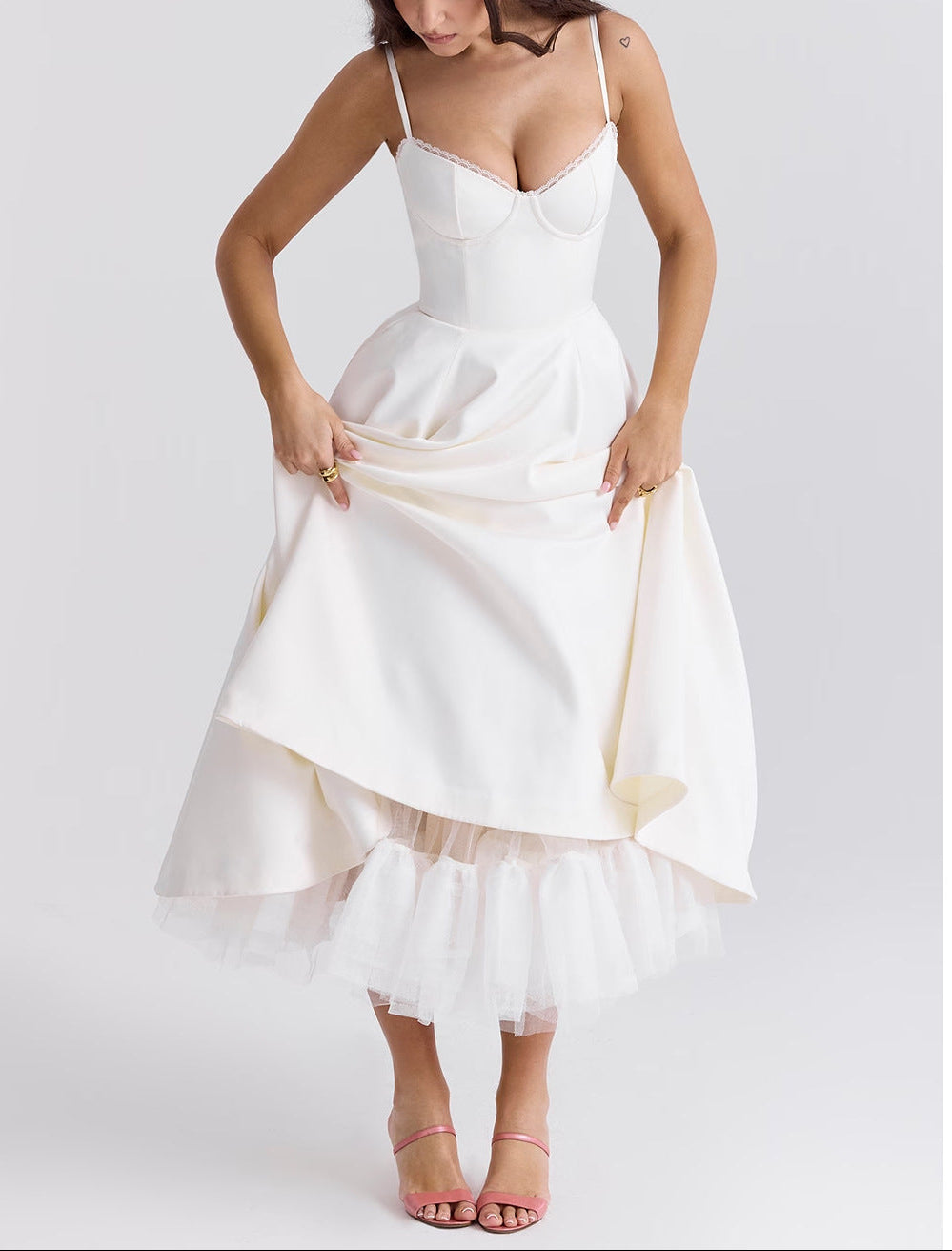 White dress with a high-low hemline on a white background