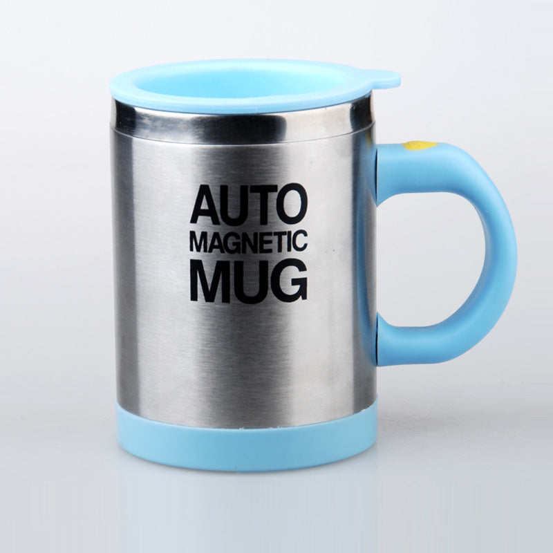 Stainless steel mug with blue handle and rim on a light gray background