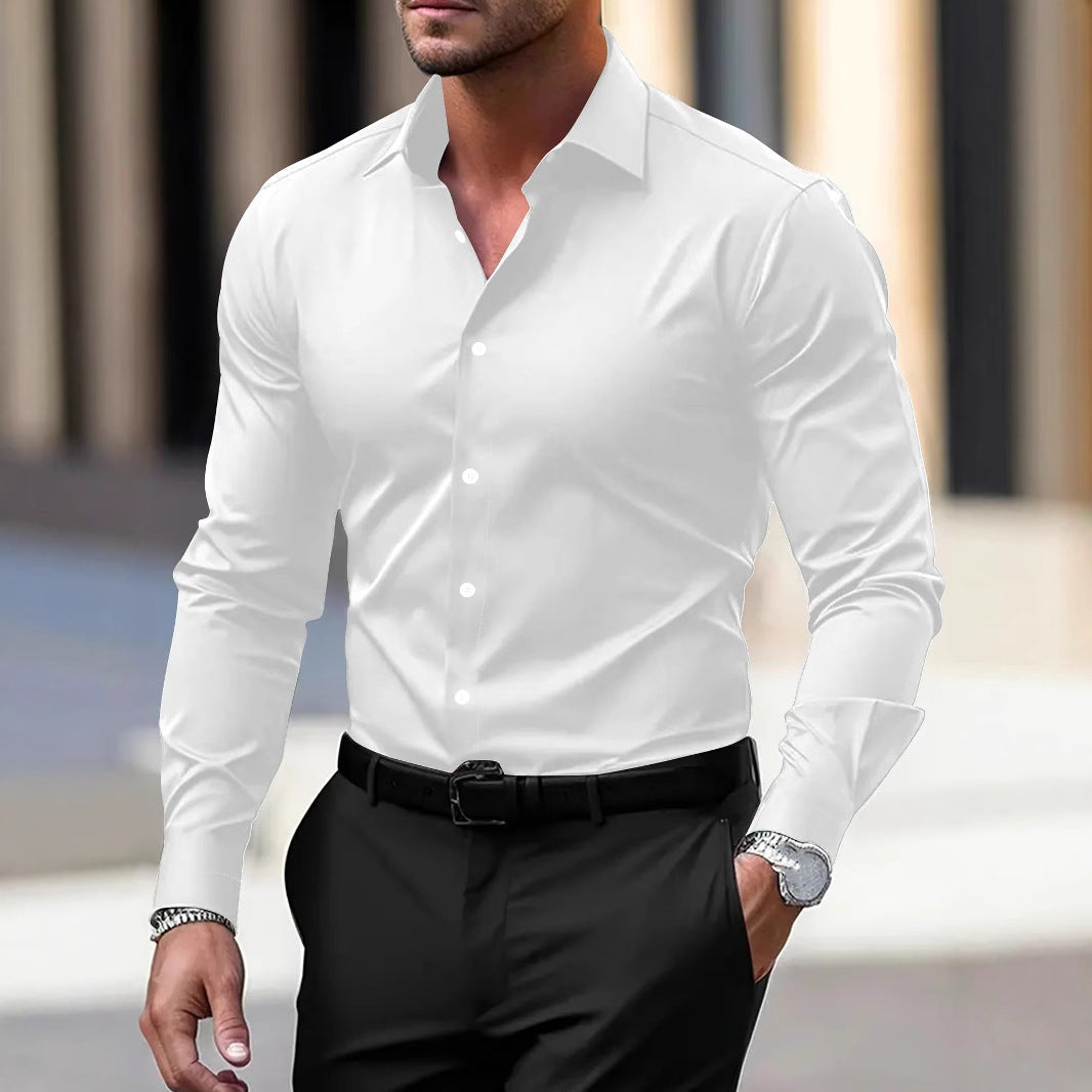 Man wearing a white dress shirt and black pants with a blurred background