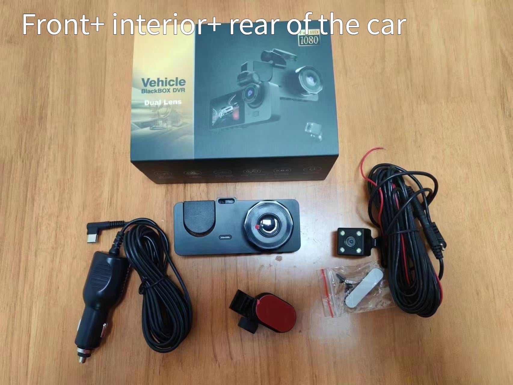 Car dashboard camera with accessories on a wooden surface