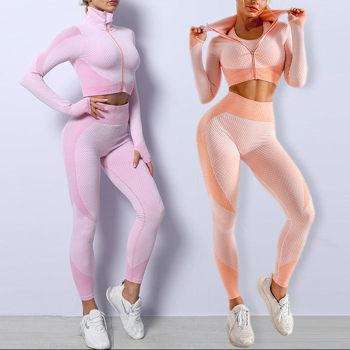 Two women wearing pink and peach athletic outfits against a light gray background