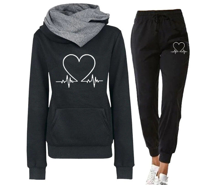 Black hoodie and jogger set with heart design on a white background
