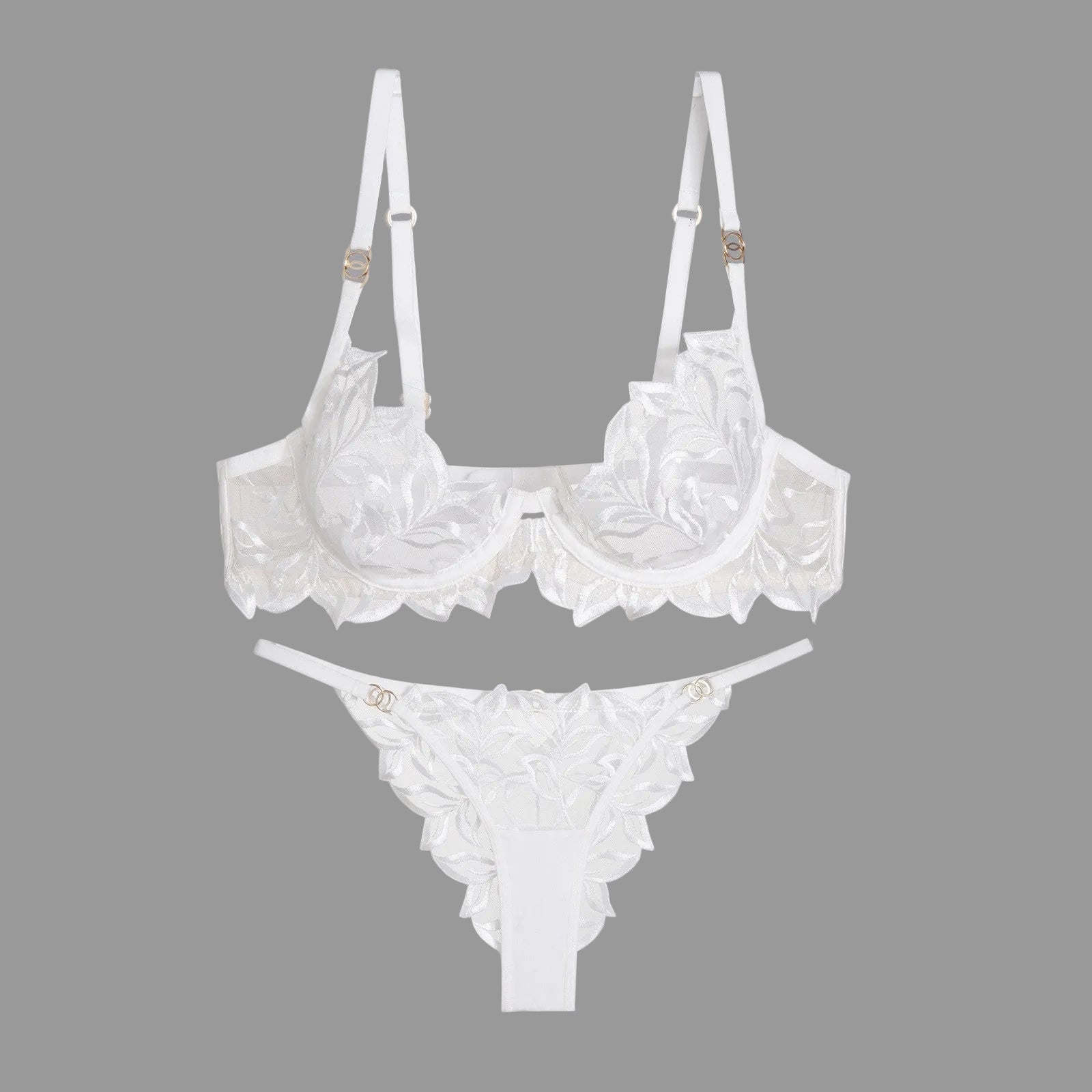 White lace bra and thong set on a gray background