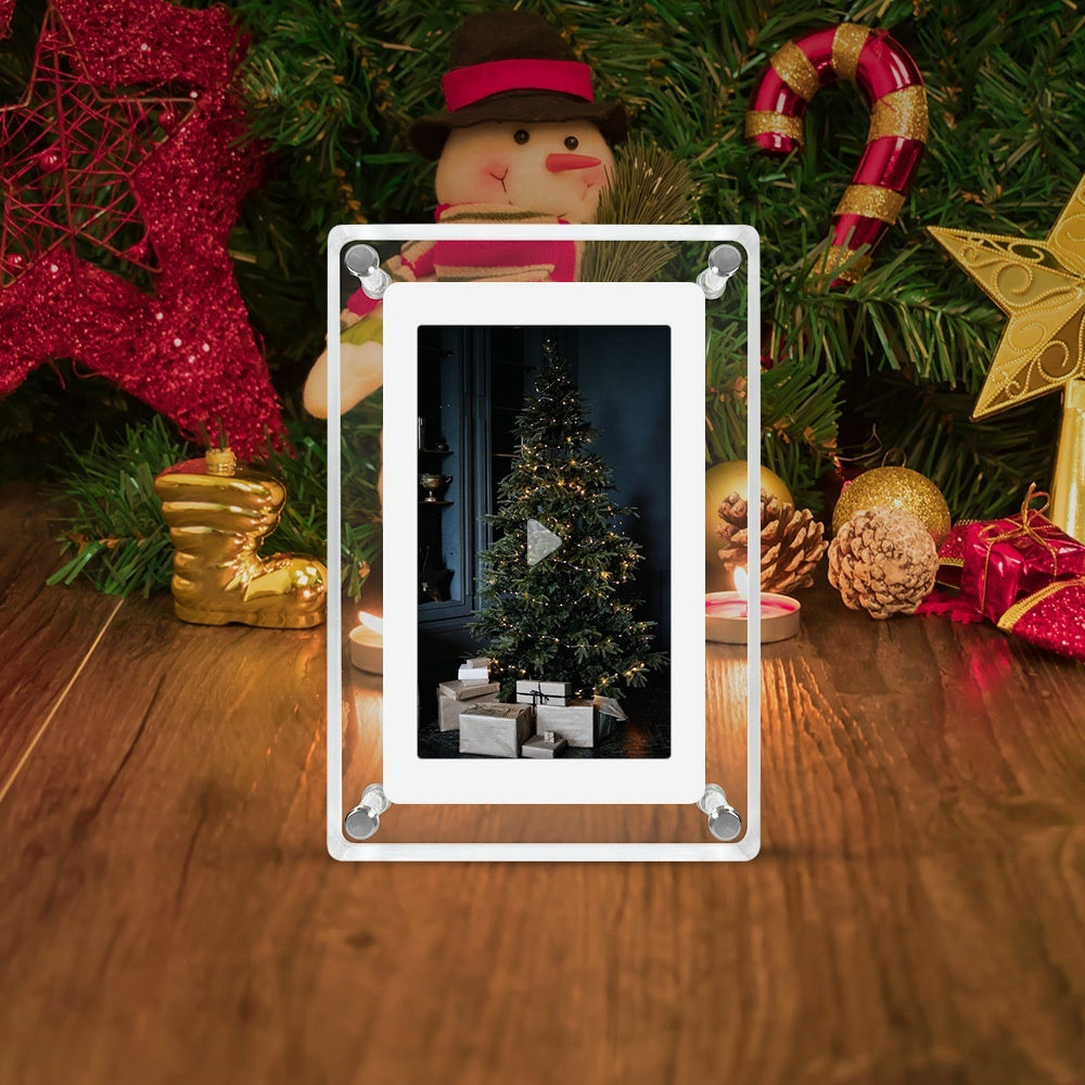 Christmas-themed scene with a small Christmas tree and presents, framed by festive decorations on a wooden surface.