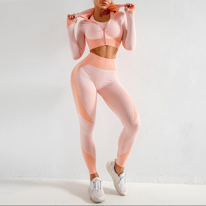 Woman wearing a pink athletic outfit on a white background