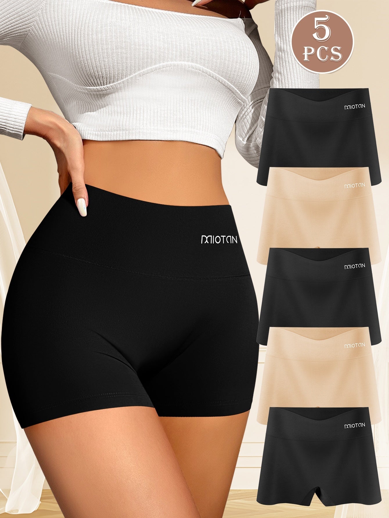Black athletic shorts with a brand logo, shown on a person and in separate images.