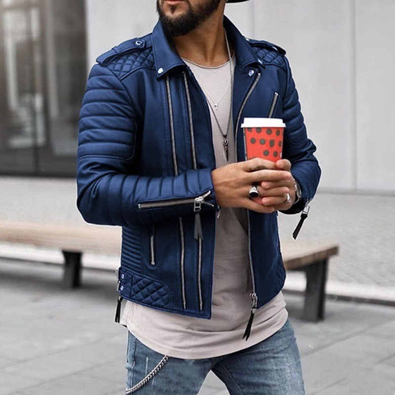 Man wearing a blue leather jacket holding a red coffee cup outdoors.