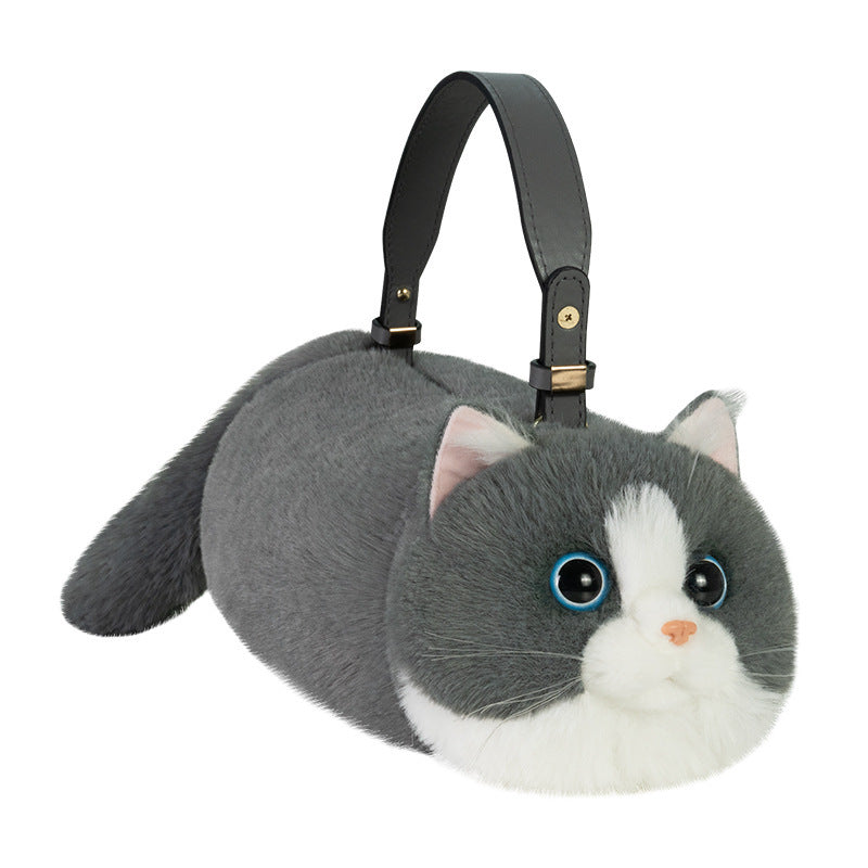 Plush cat-shaped bag with a black handle on a white background