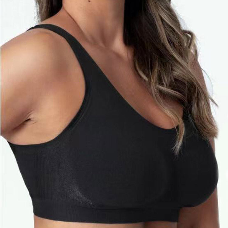 Black sports bra worn by a person on a white background