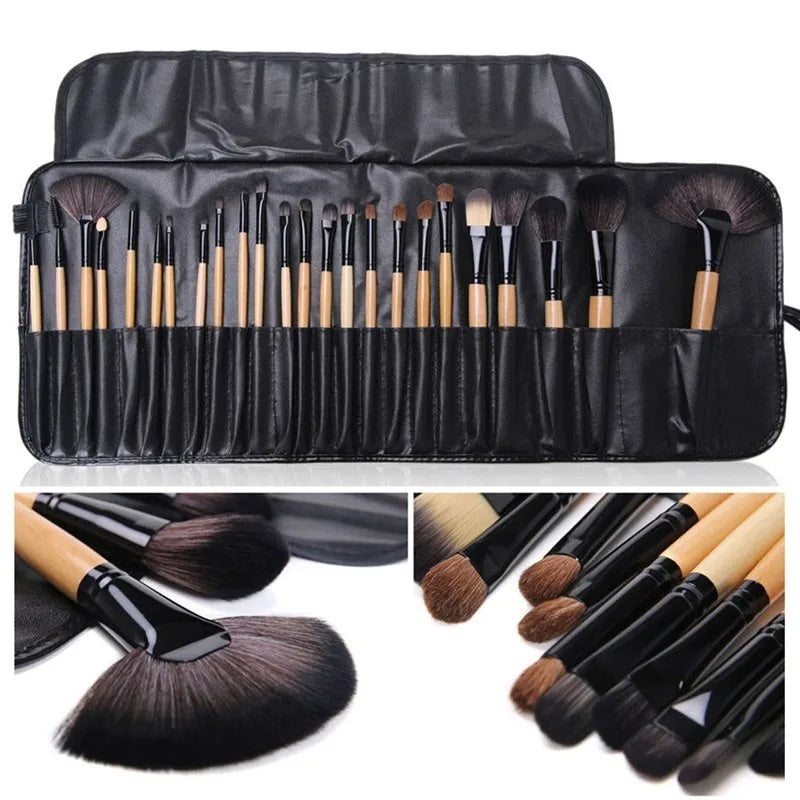 Set of makeup brushes with a black case on a white background