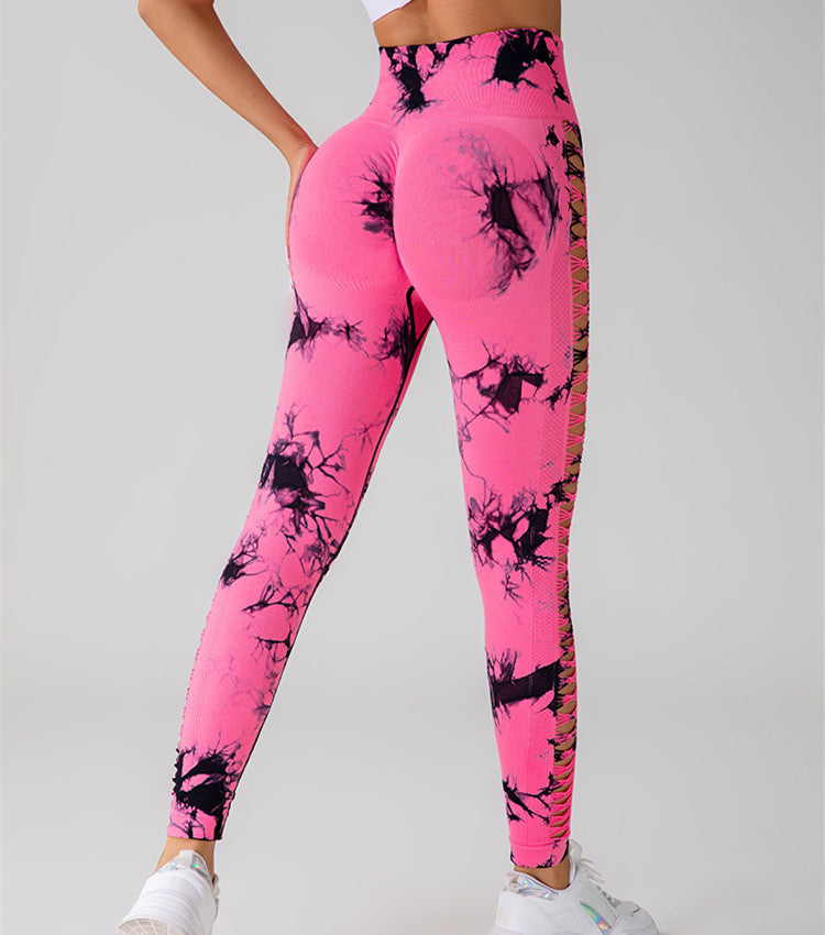 Pink leggings with black abstract patterns on a gray background
