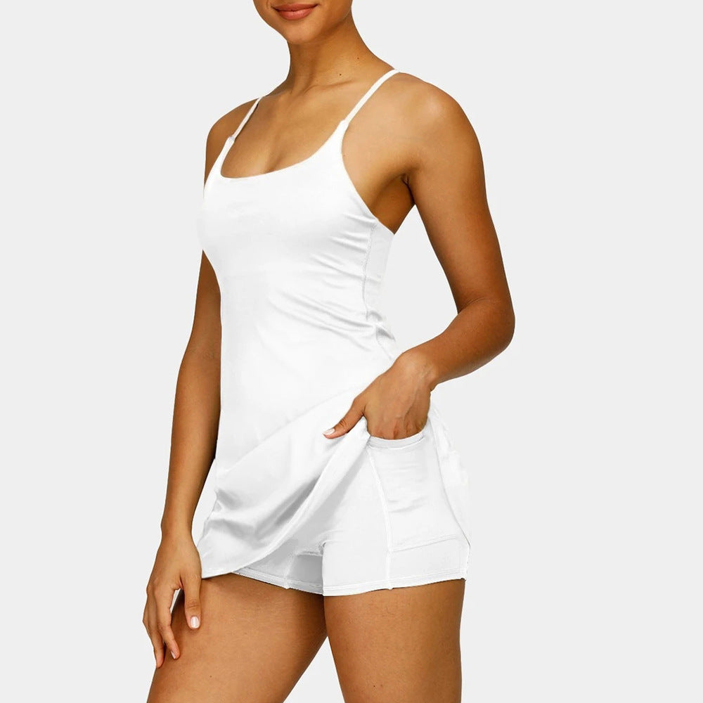 Woman wearing a white satin nightgown on a plain background